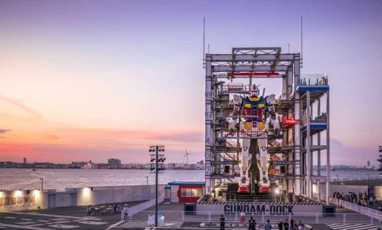 A stunning sunset view of the Gundam robot at Yokohama's waterfront, Japan.