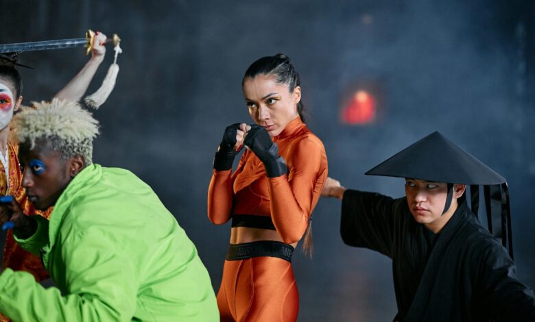 A dynamic group of cosplayers executing vivid poses indoors, evoking vibrant and dramatic themes.