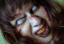 Frightening close-up of a zombie with white eyes and gory makeup, perfect for Halloween themes.