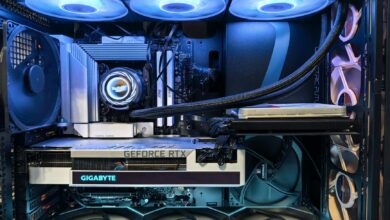 Close-up of an advanced gaming desktop PC with GeForce RTX, liquid cooling, and RGB lighting.