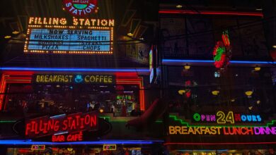 Neon signs of Filling Station Bar Cafe showcasing 24-hour service, breakfast, and coffee.
