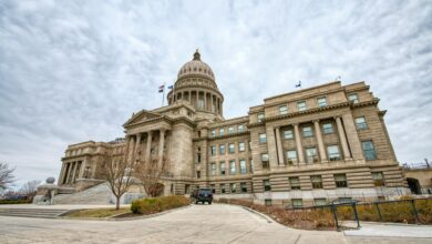 Majestic view of the Idaho State Capitol with its iconic dome under a cloudy sky.