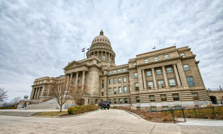 Majestic view of the Idaho State Capitol with its iconic dome under a cloudy sky.
