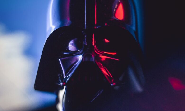 Close-up of a Darth Vader mask with striking lighting effects, showcasing cinematic appeal.