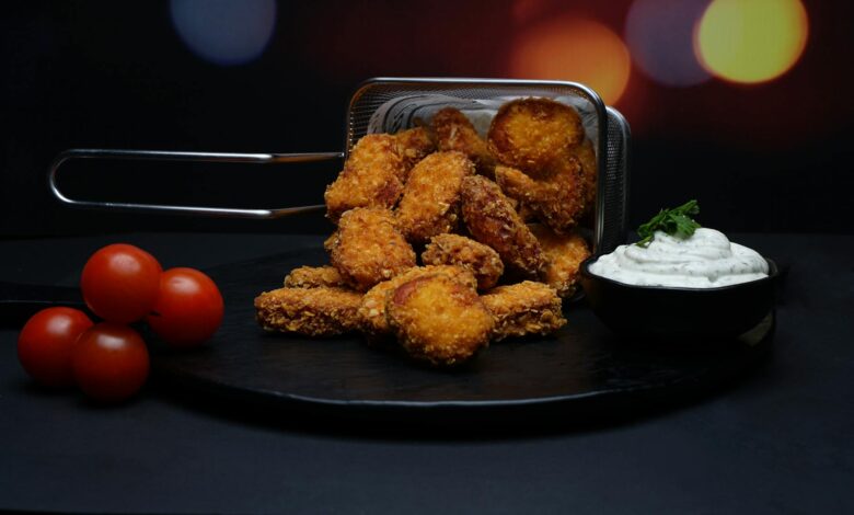 Delicious crispy nuggets served with fresh cherry tomatoes and a side of creamy dipping sauce.