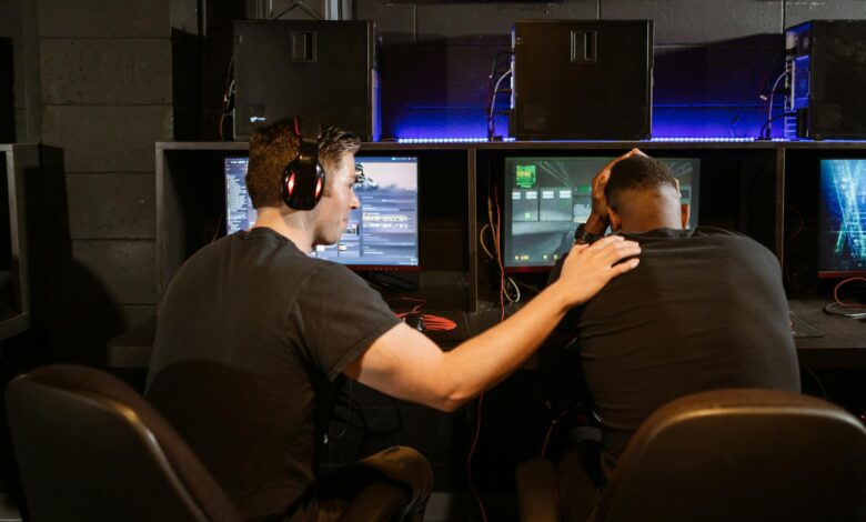 Two gamers support each other in a cyber cafe, navigating challenges together.