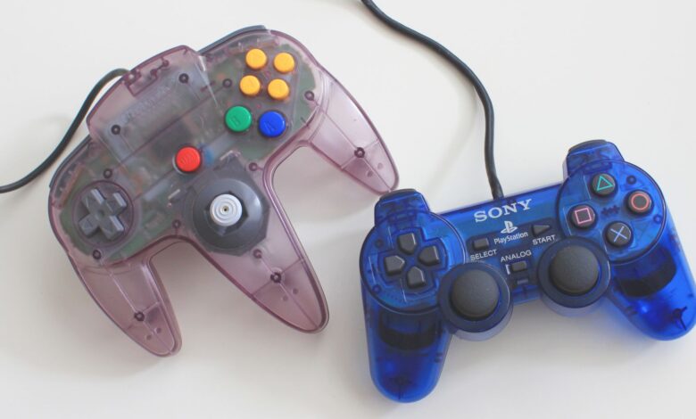 Two translucent gaming controllers, Sony PlayStation and Nintendo, on a white surface.