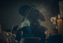 A mysterious figure in a plague doctor mask amidst candlelight and smoke, creating an eerie atmosphere.