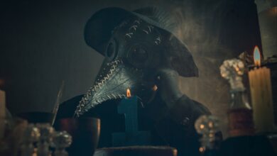 A mysterious figure in a plague doctor mask amidst candlelight and smoke, creating an eerie atmosphere.