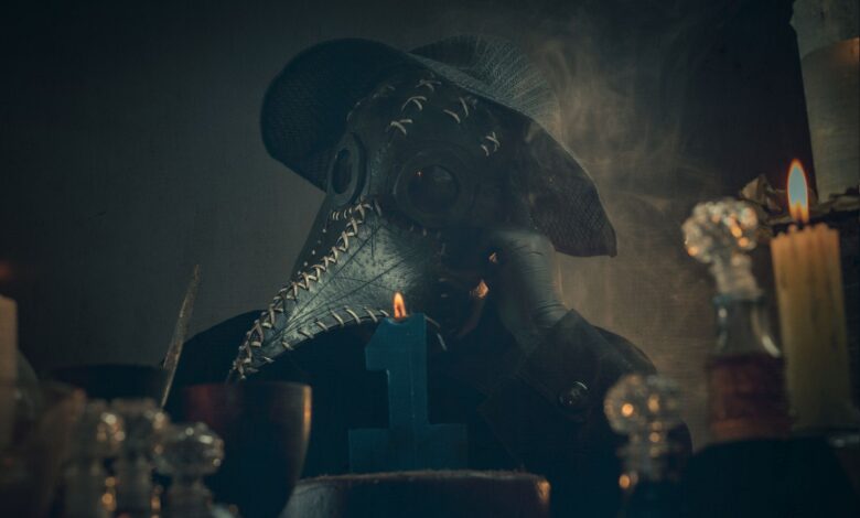 A mysterious figure in a plague doctor mask amidst candlelight and smoke, creating an eerie atmosphere.
