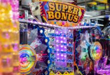 Colorful neon arcade machine featuring a 'Super Bonus' display with bright lights and playful design.