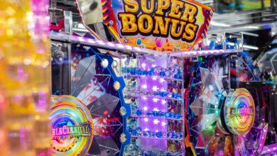 Colorful neon arcade machine featuring a 'Super Bonus' display with bright lights and playful design.