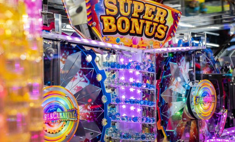 Colorful neon arcade machine featuring a 'Super Bonus' display with bright lights and playful design.