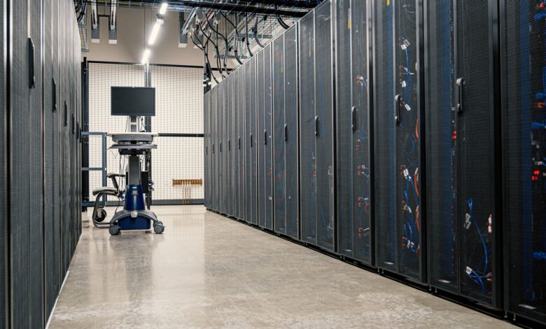Steel framework cabinets housing servers networking devices and cables in contemporary equipped data center