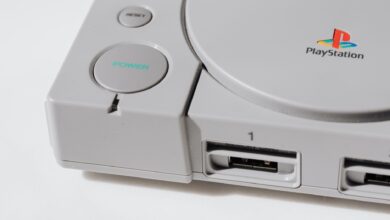 Close-up view of a classic PlayStation gaming console from the 90s, showcasing its iconic design.