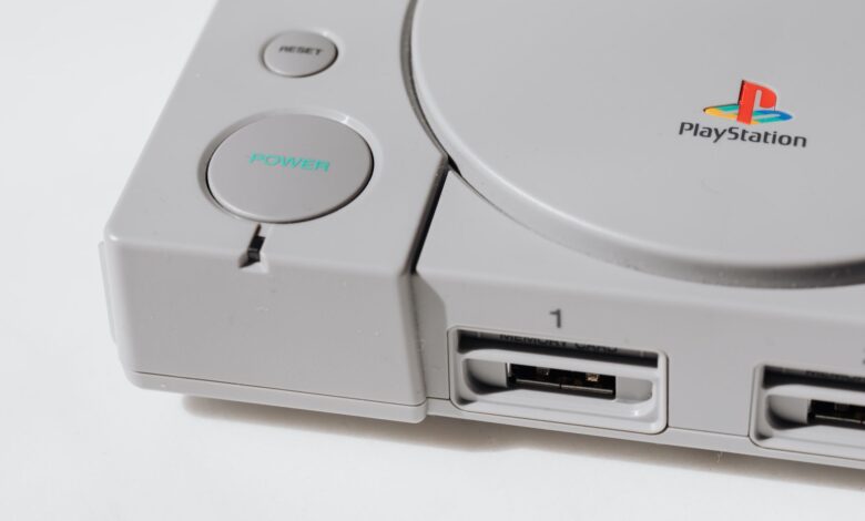 Close-up view of a classic PlayStation gaming console from the 90s, showcasing its iconic design.