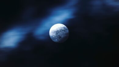 Stunning view of the moon amidst a dark, ethereal night sky, captured with crisp clarity.