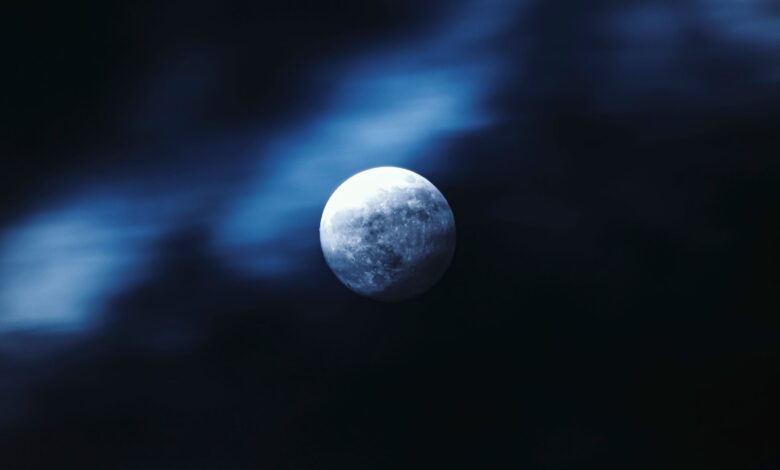 Stunning view of the moon amidst a dark, ethereal night sky, captured with crisp clarity.
