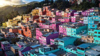 Aerial view of vibrant, colorful houses on a hillside in Bogotá, Colombia.