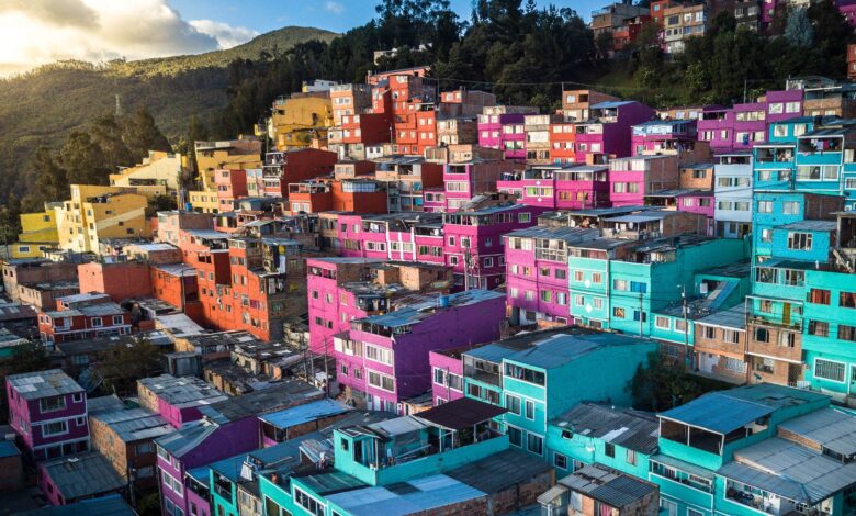 Aerial view of vibrant, colorful houses on a hillside in Bogotá, Colombia.