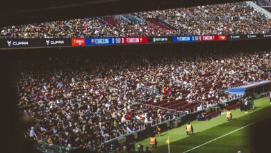 Packed stadium with spectators at an FC Barcelona soccer match, vibrant atmosphere.