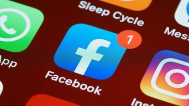 A detailed close-up of social media app icons on a smartphone screen.
