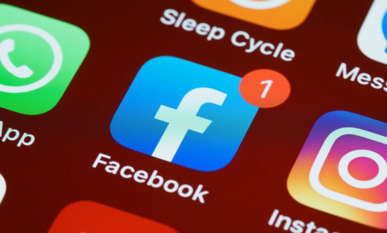 A detailed close-up of social media app icons on a smartphone screen.