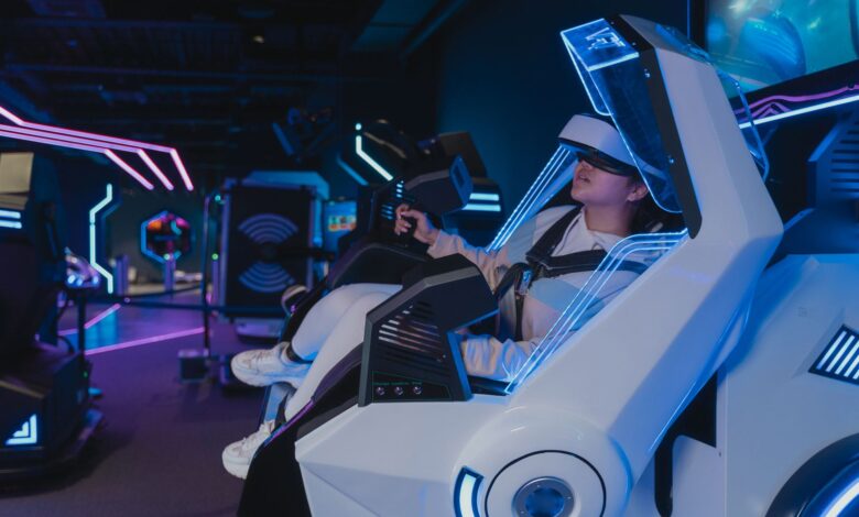 A woman enjoying a virtual reality ride in a futuristic, neon-lit arcade setting.