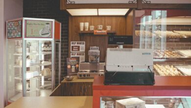 Cozy bakery interior showcasing pastries, pies, and a vintage cash register for a nostalgic vibe.