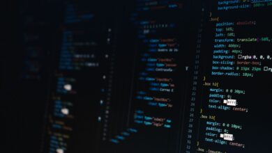 Detailed view of HTML and CSS code on a dark screen, representing modern web development.
