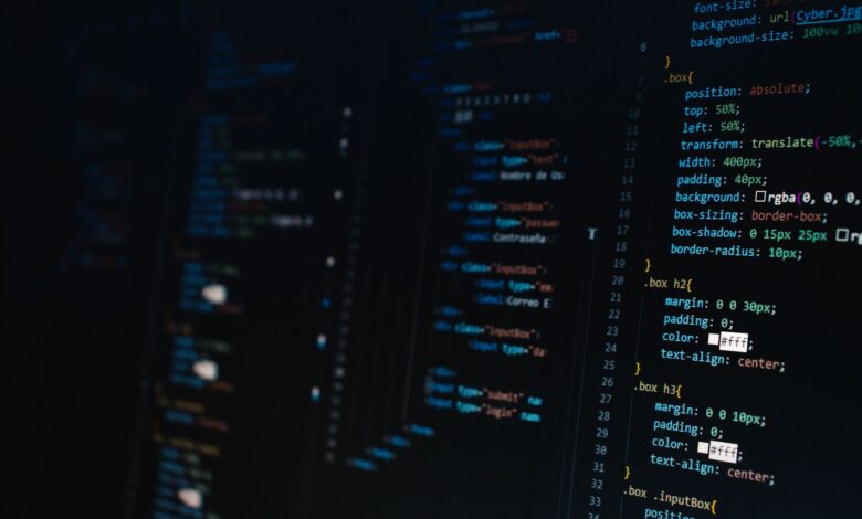 Detailed view of HTML and CSS code on a dark screen, representing modern web development.