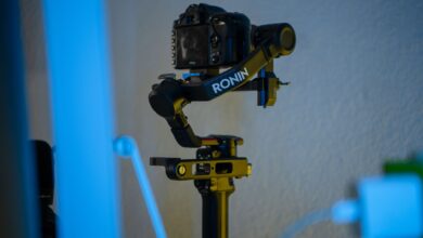 A professional camera mounted on a Ronin stabilizer in an indoor setting, offering smooth filming capabilities.