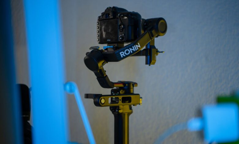 A professional camera mounted on a Ronin stabilizer in an indoor setting, offering smooth filming capabilities.