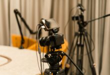 A professional studio with cameras, microphones, and other equipment ready for recording or live streaming.
