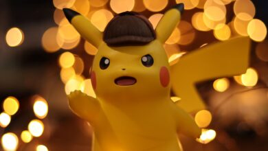 A close-up of a Pikachu figurine illuminated by a warm bokeh effect, creating an eye-catching visual.