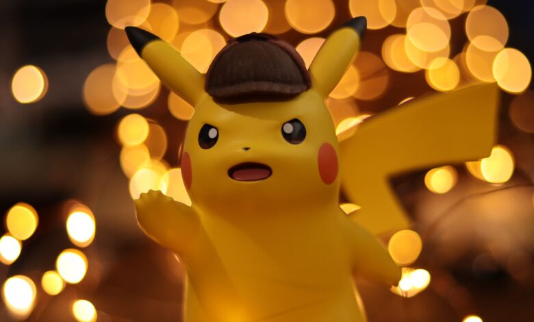 A close-up of a Pikachu figurine illuminated by a warm bokeh effect, creating an eye-catching visual.