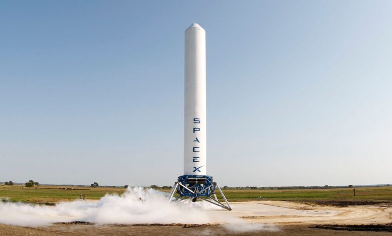 A SpaceX rocket prepares for launch in a rural landscape, capturing a sense of technological advancement.