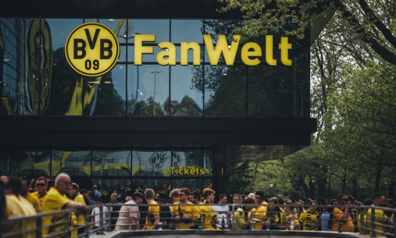 Fans gather at Dortmund's Fanwelt outside Signal Iduna Park on match day.