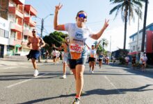 Energetic runners participating in a city marathon, showcasing enthusiasm and sportsmanship.