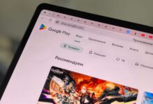 Close-up of a tablet displaying the Google Play Store interface in Russian.