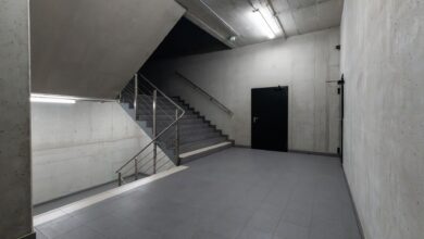 A modern and minimalist concrete stairwell showcasing industrial architecture.