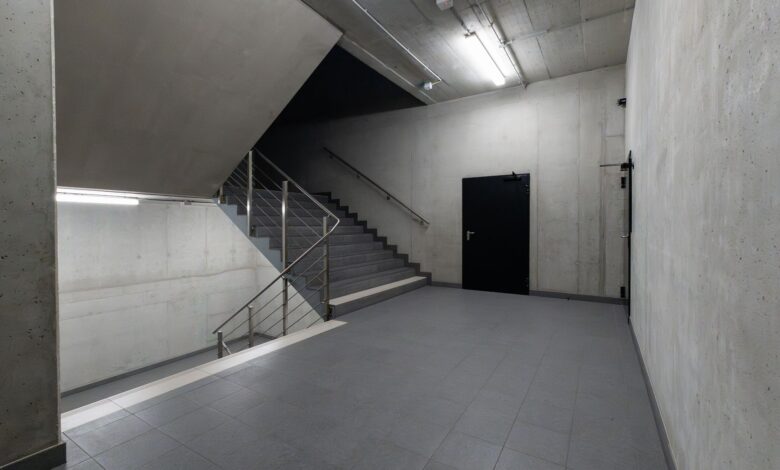 A modern and minimalist concrete stairwell showcasing industrial architecture.