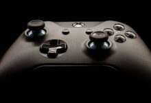 A detailed close-up of a modern gaming controller highlighting its design and functionality.