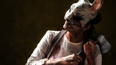 Creepy figure in rabbit mask holding axe, evoking horror theme. Perfect for Halloween content.