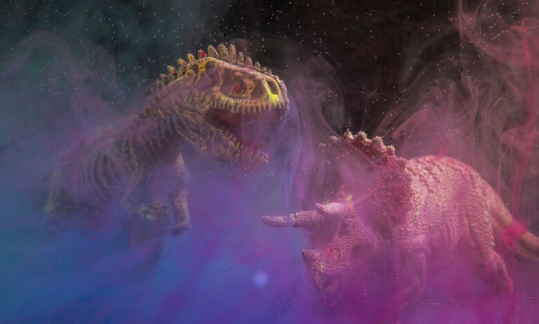 Artistic depiction of dinosaur toys in vibrant smoke, featuring a T-Rex and Triceratops in a studio setting.