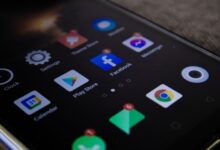 Detailed view of a smartphone screen with popular app icons including Facebook and Messenger.