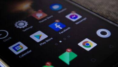 Detailed view of a smartphone screen with popular app icons including Facebook and Messenger.