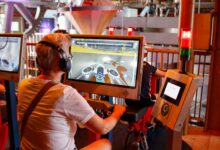 Individual using interactive simulator at a tech exhibit indoors.