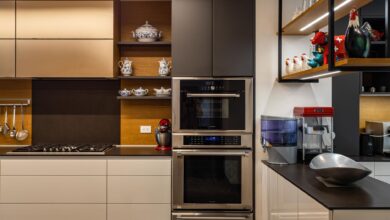 Contemporary kitchen design featuring sleek cabinets, dual ovens, and chic decor.