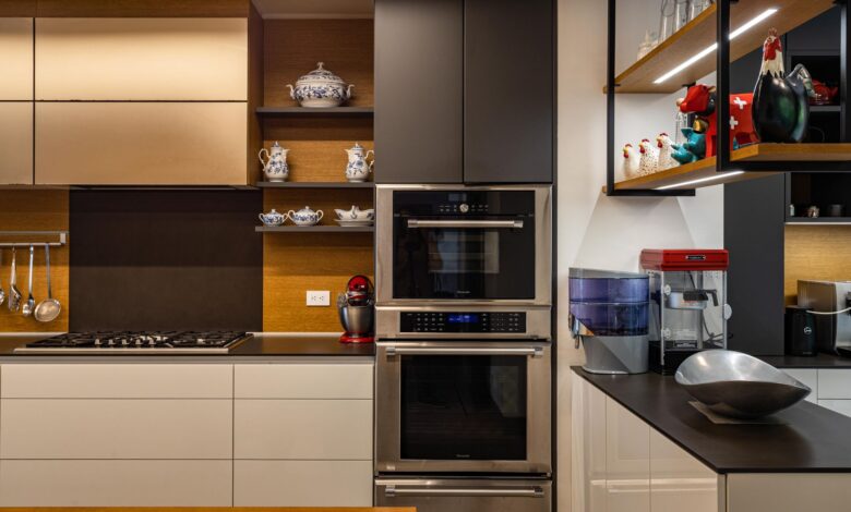 Contemporary kitchen design featuring sleek cabinets, dual ovens, and chic decor.